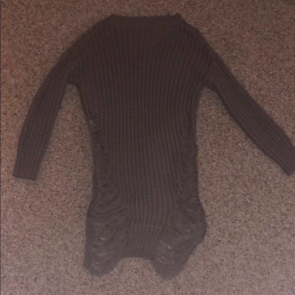 A long knitted sweater